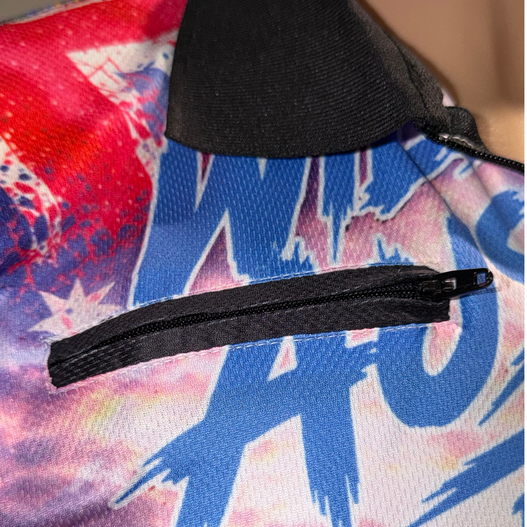 Close-up of zip chest pocket on Wild Mob fishing shirt