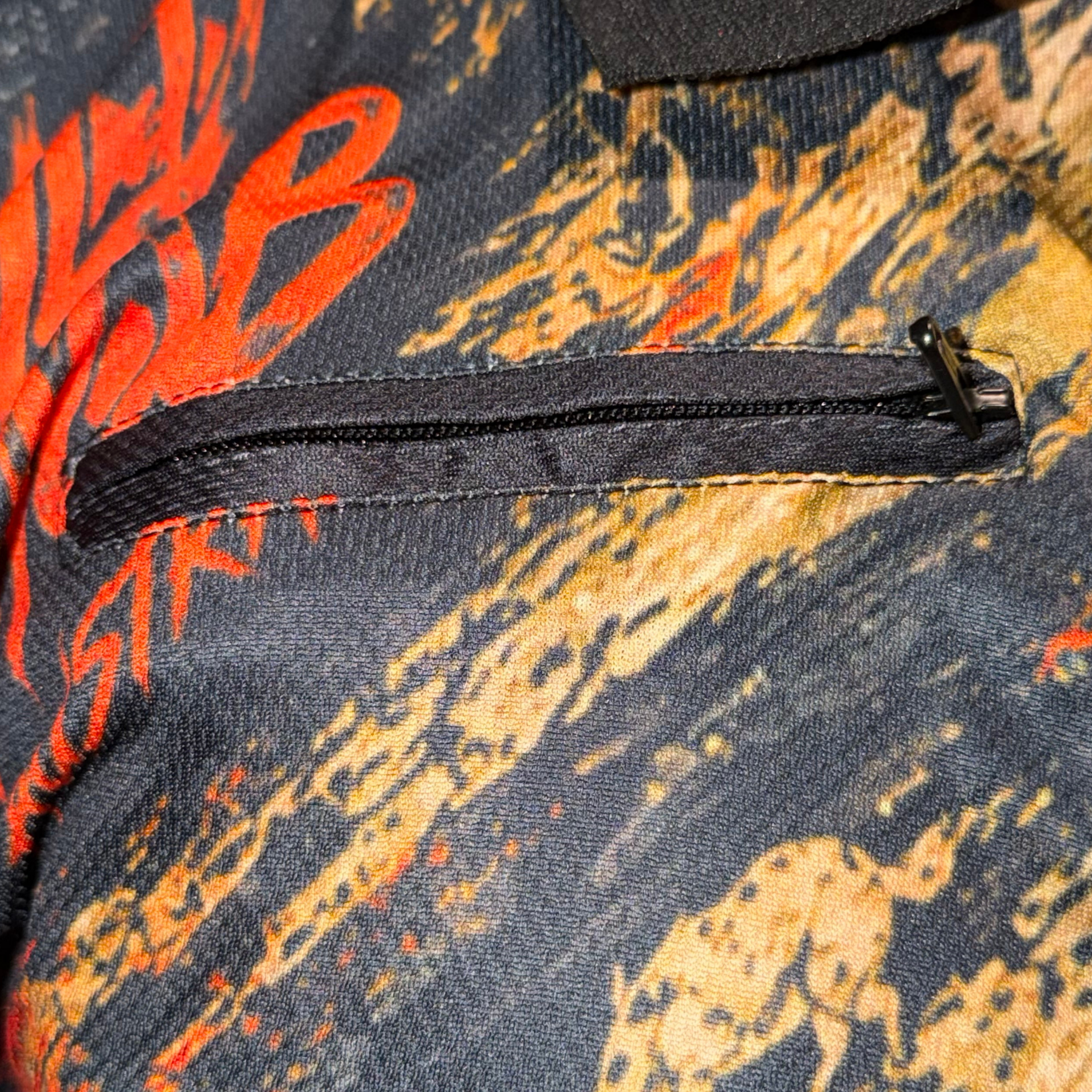 Close-up of zip chest pocket on Wild Mob fishing shirt